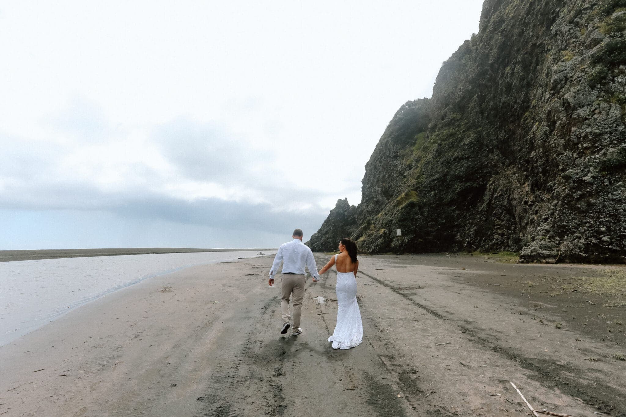 Black sand, vineyard rows, and the sea at your feet.