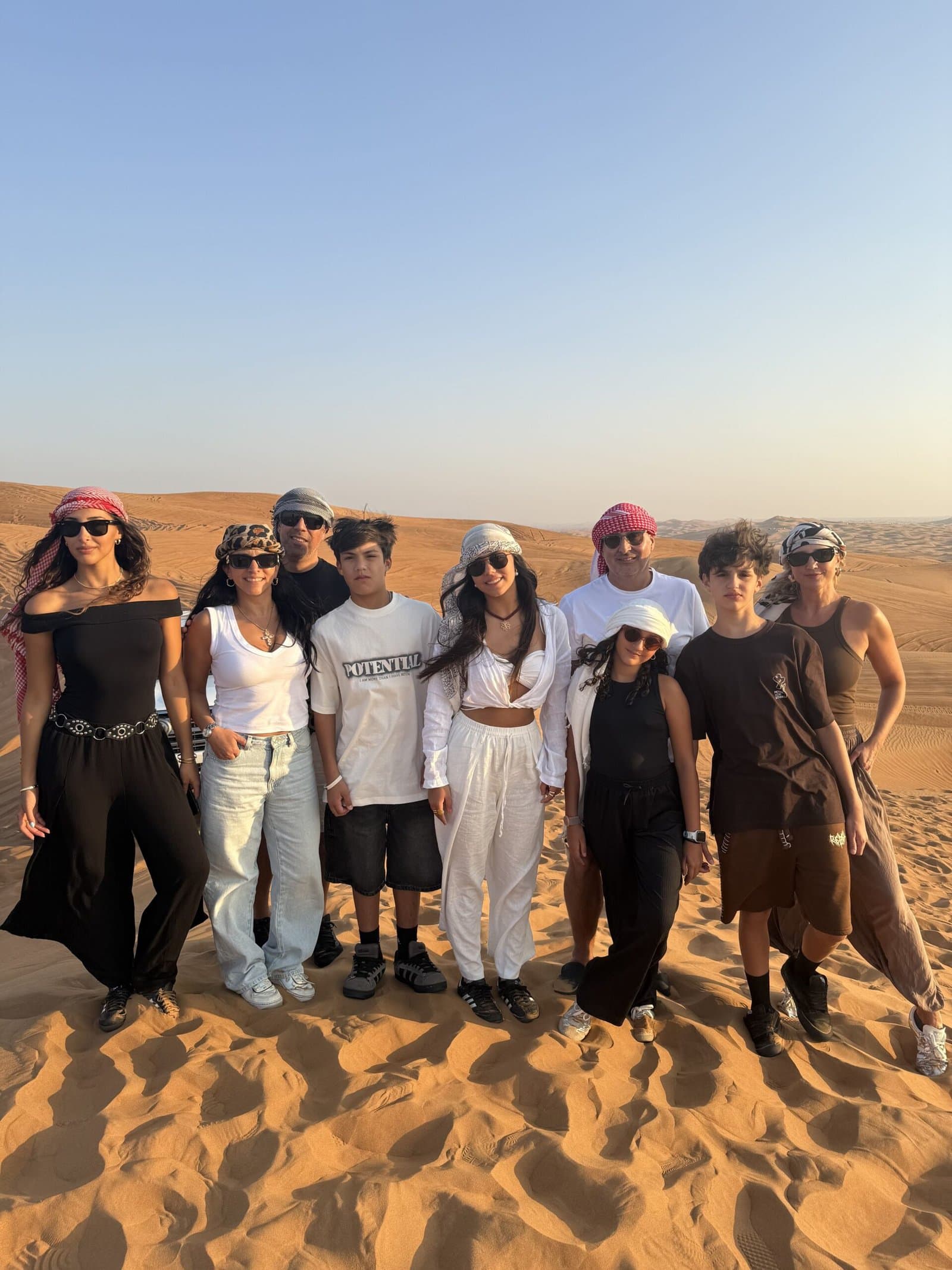 Camel ride at sunset during VIP desert safari Lahbab dunes