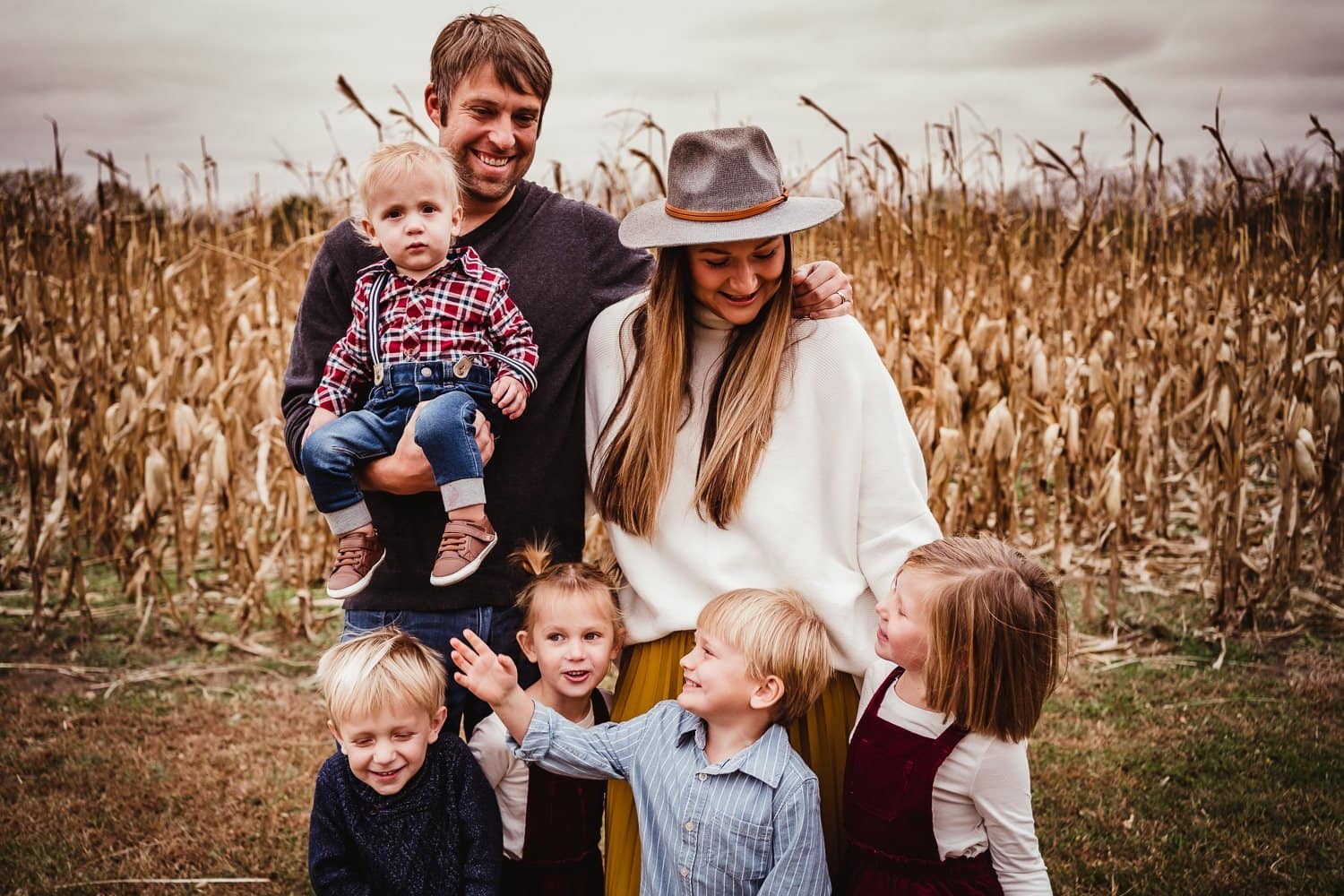 family with young kids running and playing with smile and laughing portrait photo