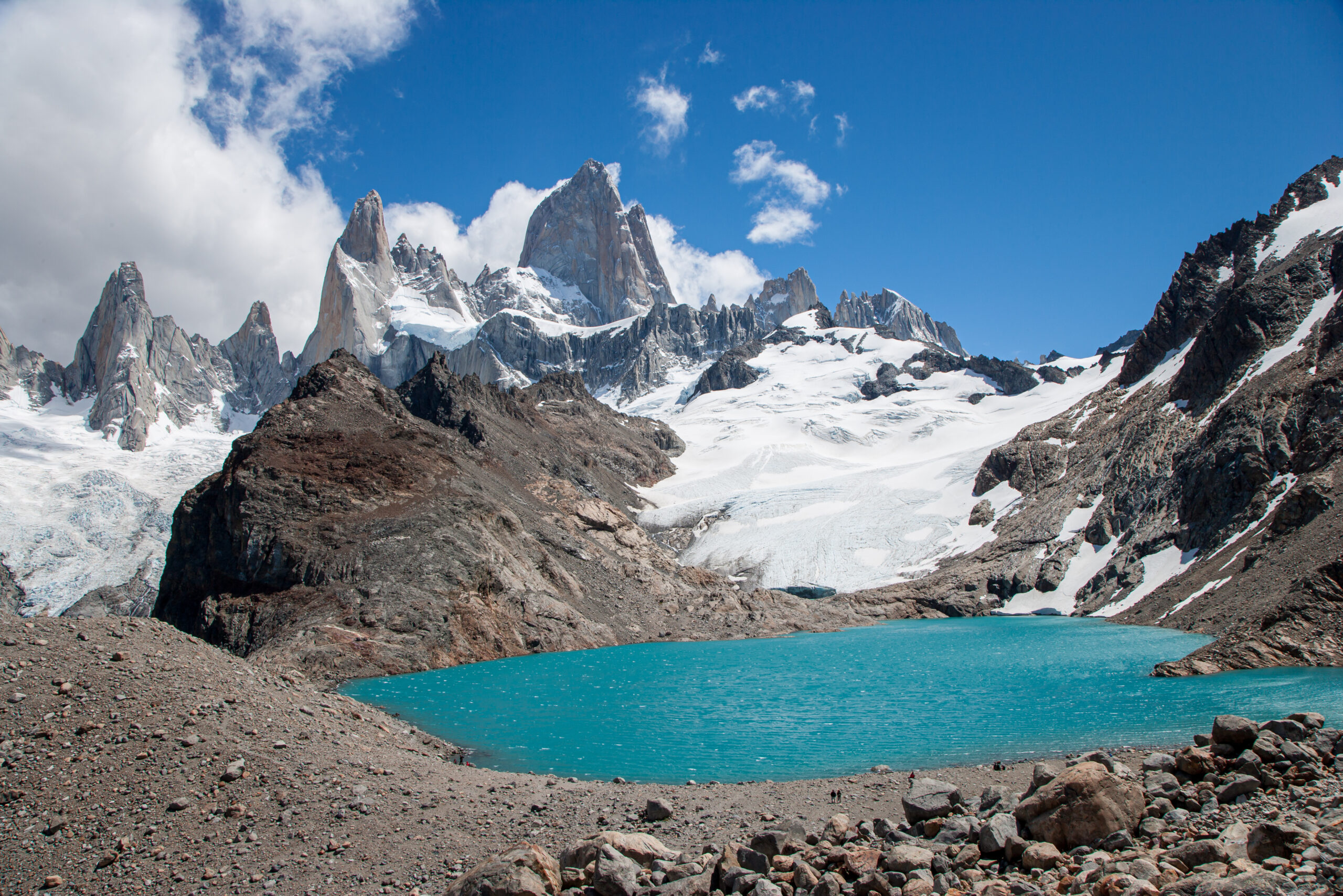 Fitz Roy mountain in Patagonia Argentina — also known as Cerro Chaltén meaning Smoking Mountain in the Tehuelche language — the iconic 3405-meter granite spire on the Argentina-Chile border in Los Glaciares National Park as viewed from the El Chaltén approach with the distinctive jagged skyline used as the Patagonia clothing brand logo