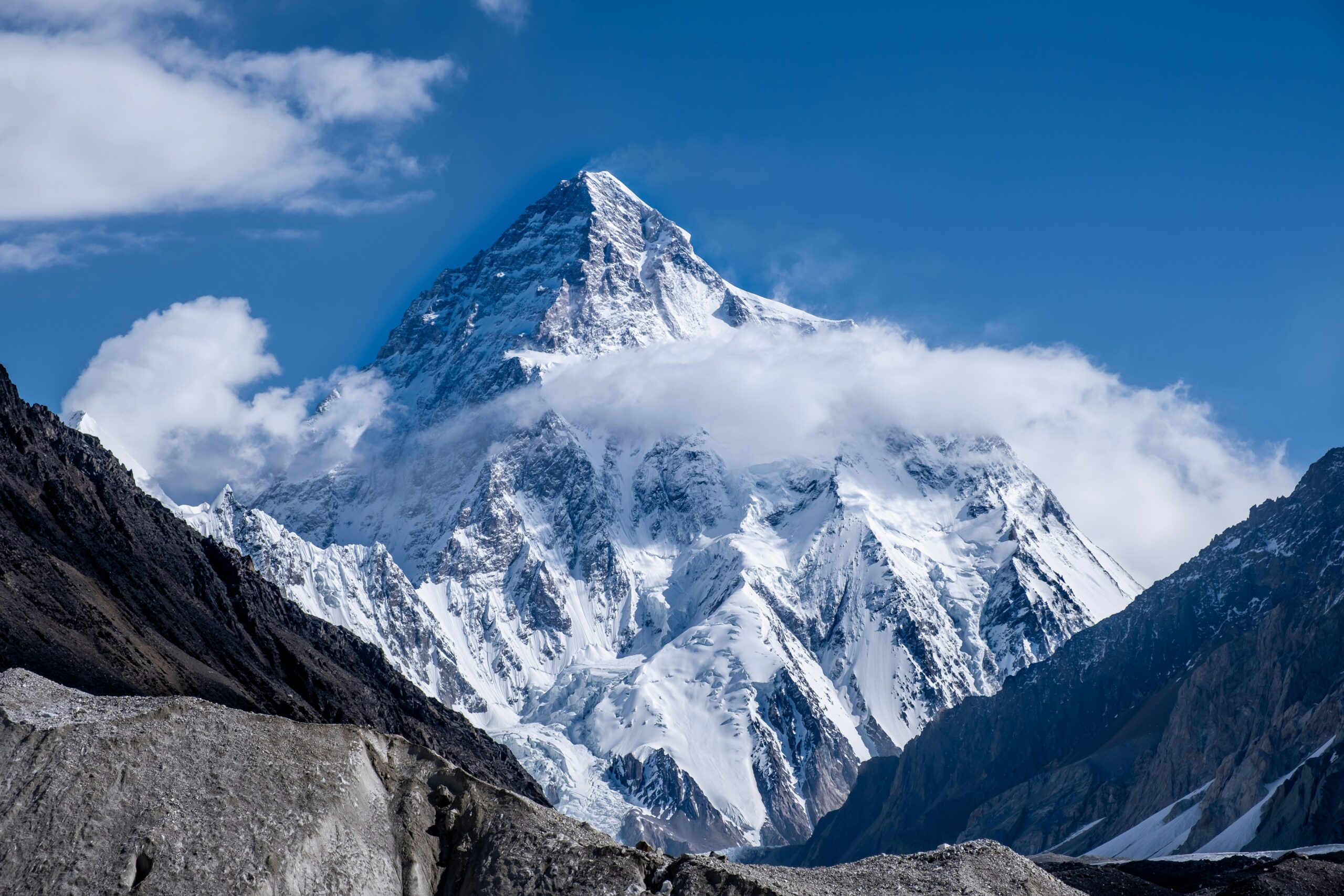K2 wrapped in cloud in Pakistan's Karakoram, where summit windows can be brief and unreliable
