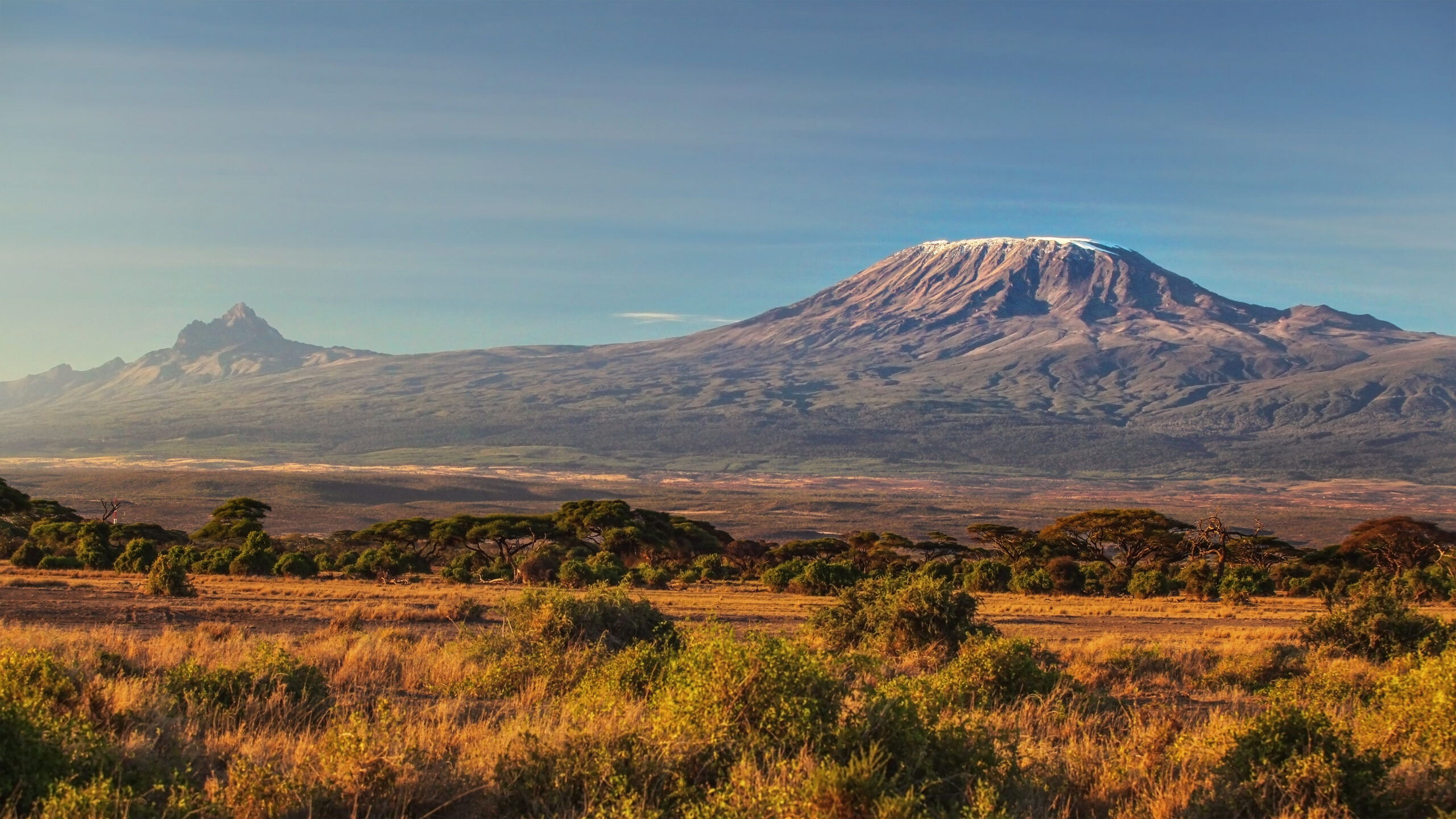 Mount Kilimanjaro rising over Tanzania's neighboring Kenyan savanna at Amboseli