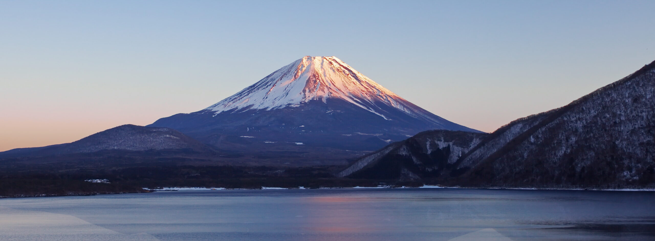 Mount Fuji rising above the clouds, the deceptively gentle-looking peak climbers most often underestimate