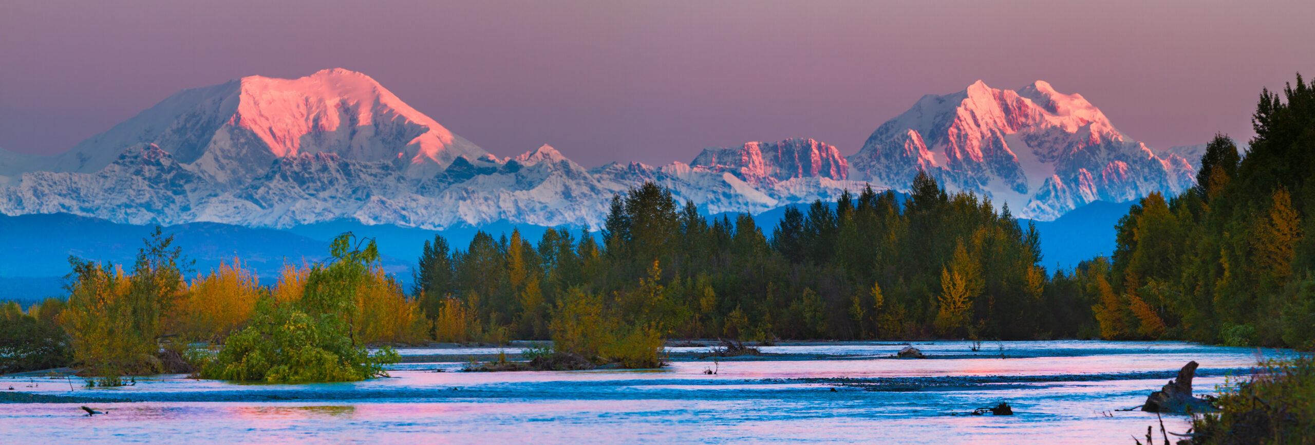 Mountain landscape and river where backcountry travelers must plan safe water treatment