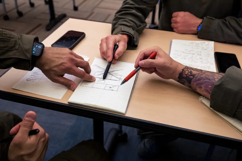 Officers work mission planning during hostage rescue training.