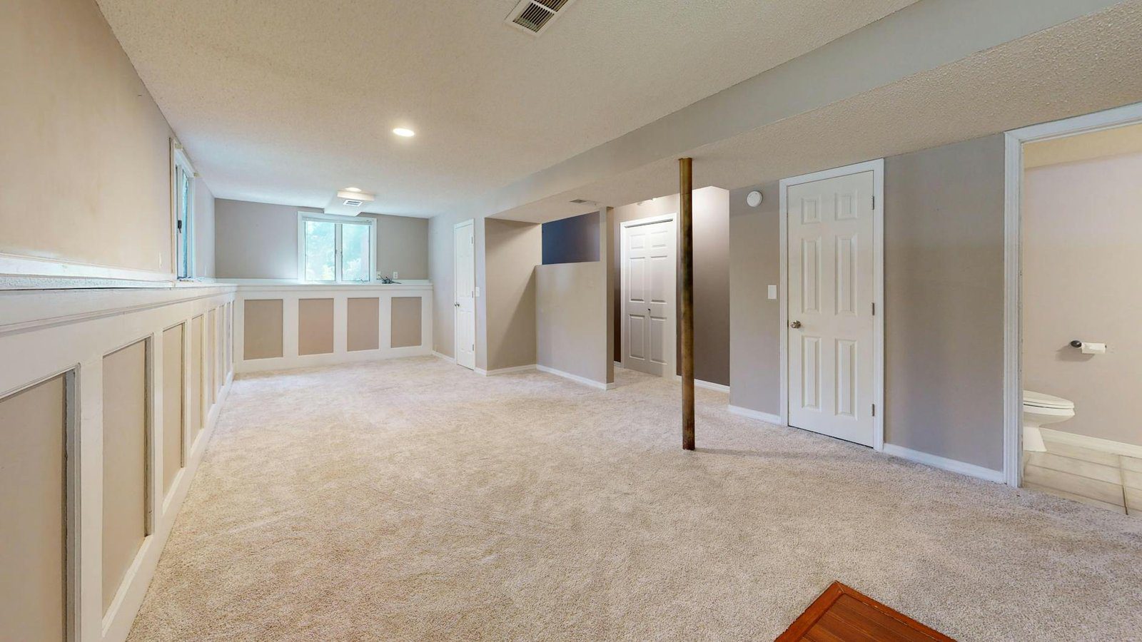 Basement Renovation project in Kitchener-Waterloo - Bright and clean modern basement with carpet flooring and recessed lighti