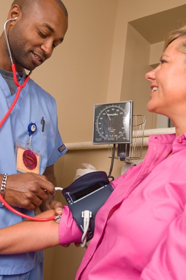 Healthcare provider examining wound for signs of infection