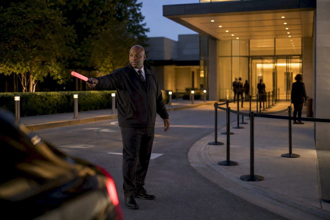 Security coordinator directing event arrival lane
