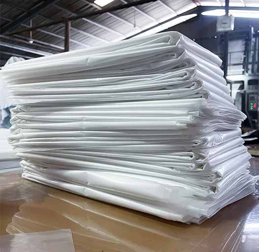 Piled LLDPE plastic film sheets in white and clear colors Piled LLDPE plastic film sheets in white and clear colors