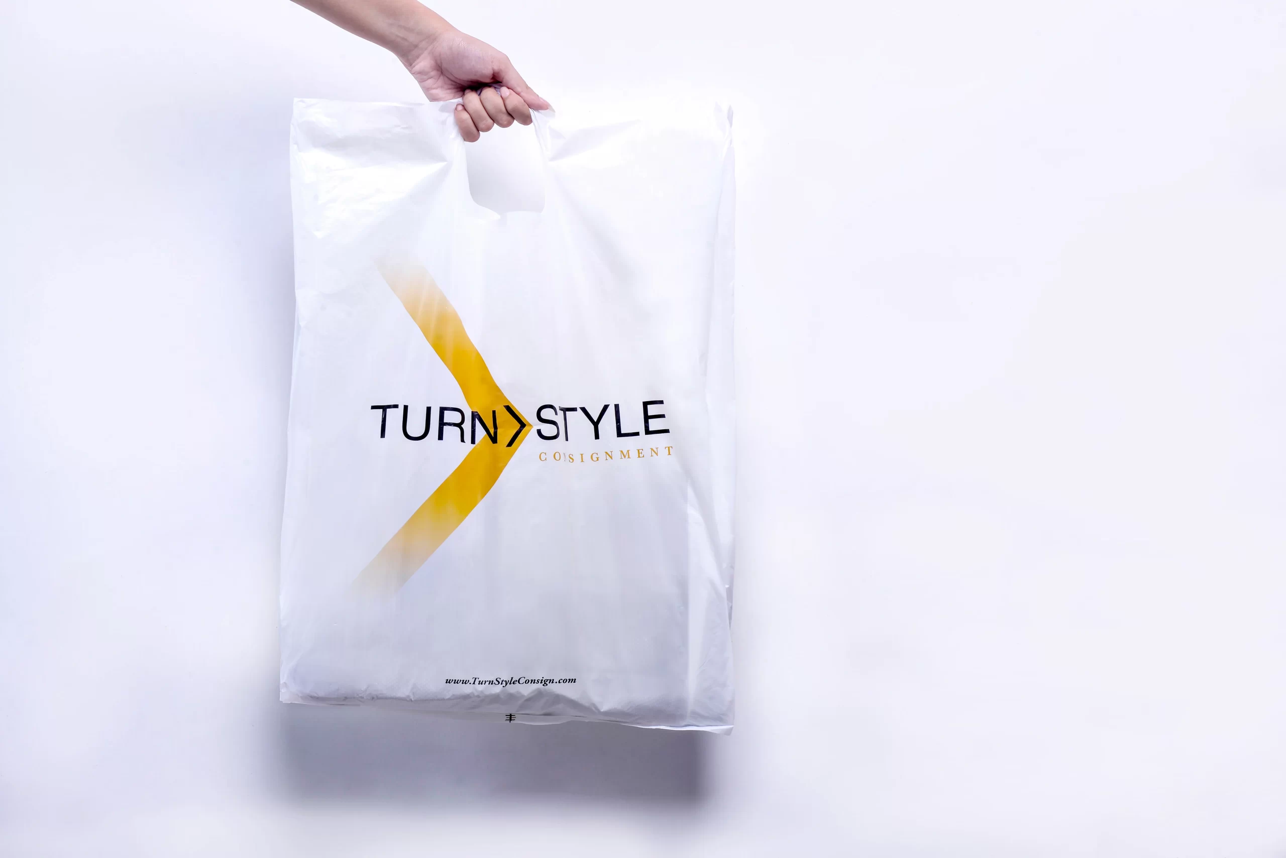Lightweight HDPE shopping bag with die-cut handles for convenience Lightweight HDPE shopping bag with die-cut handles for convenience