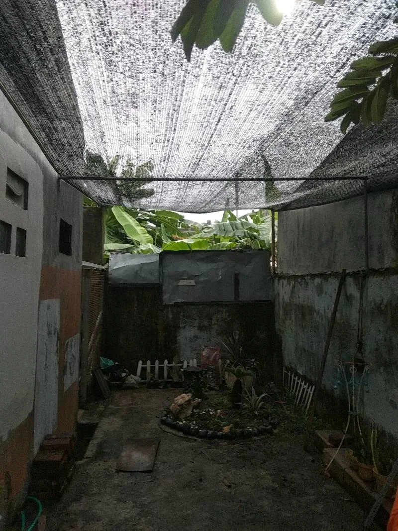 Sunshade netting setup in front of residential terrace Sunshade netting setup in front of residential terrace