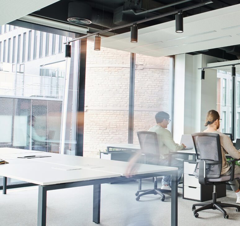Flexible shared office workspace in a modern business center.