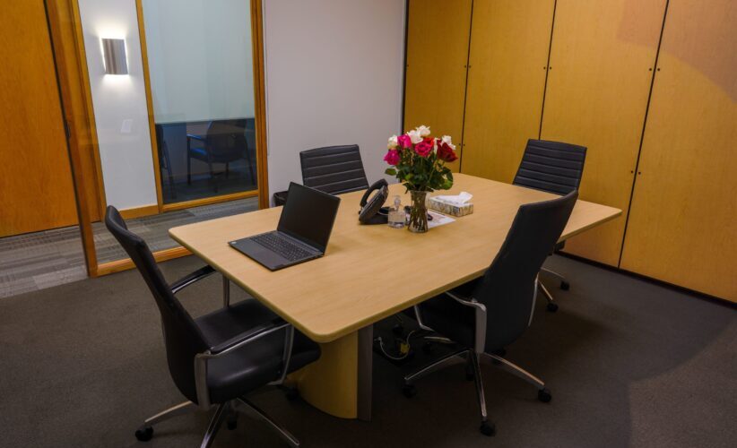 High-quality modern conference room at Intelligent Office with meeting table and office chairs.