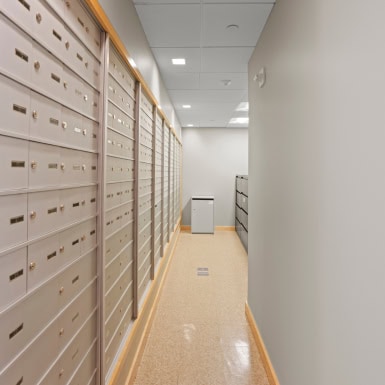 Secure mailbox lockers in a professional office setting, ideal for business correspondence and franchise operations.