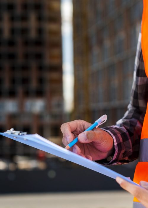 close-up-construction-engineer-writing