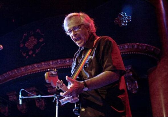 Ry Cooder Live playing guitar on stage
