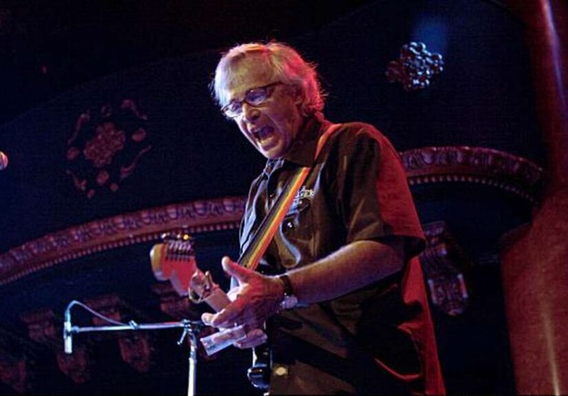 Ry Cooder Live playing guitar on stage