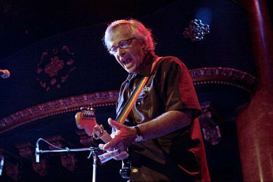 Ry Cooder Live playing guitar on stage
