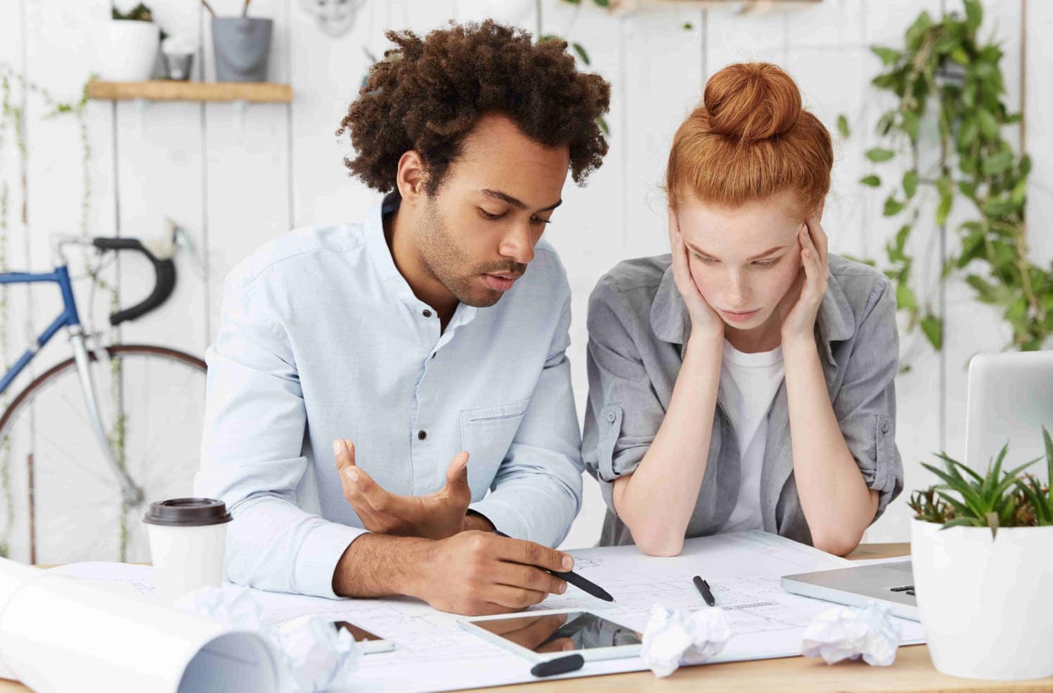 Two people working through financial and practical decisions together