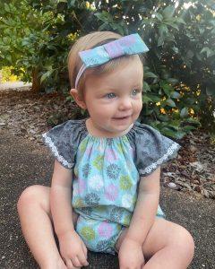 Haidee wearing Australian handmade children's clothing by Karousel Kids