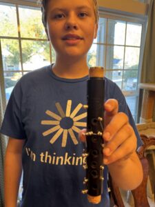Person holding a musical instrument.
