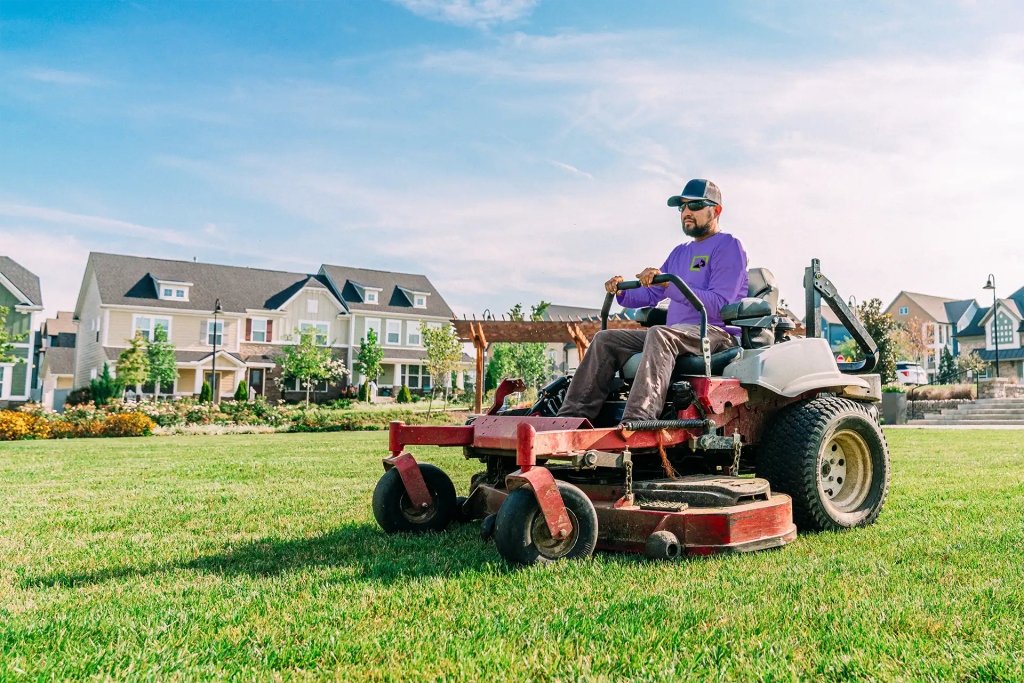 Zero-turn mower cutting Bermuda grass lawn in North Carolina