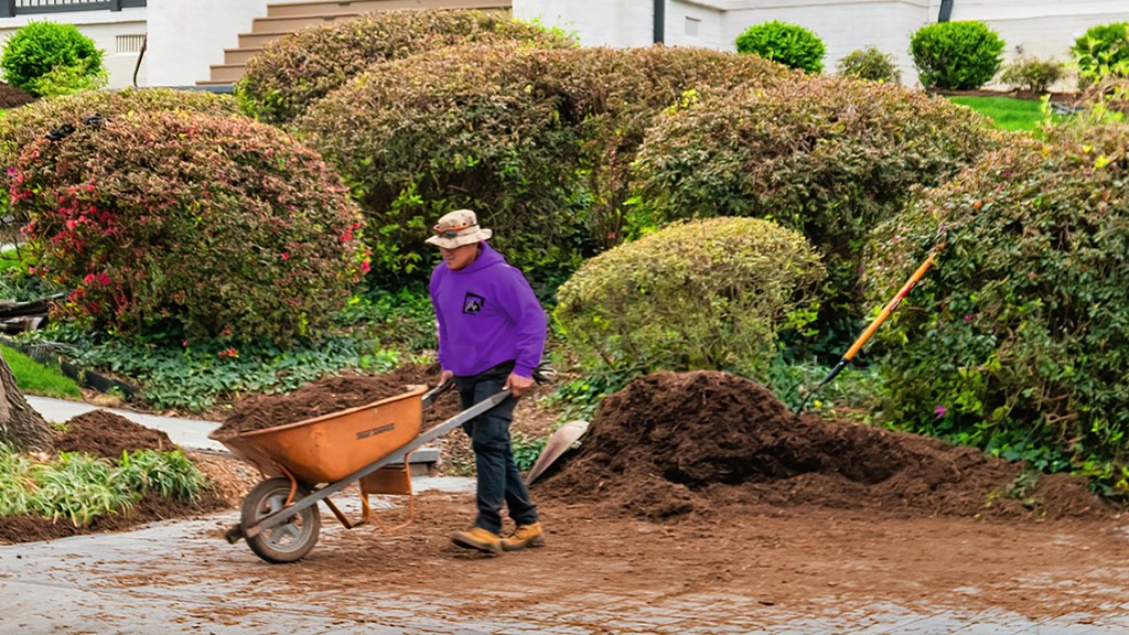 Lawn Panther installing mulch on an Apex property