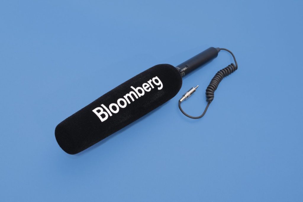 Bloomberg branded camera shotgun microphone windshield with custom logo print on cylindrical foam cover