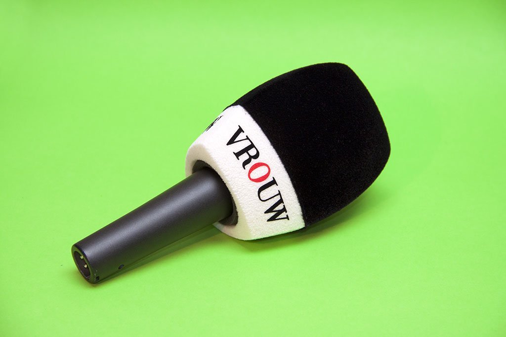VROUW branded black and white microphone windshield with red accent letter, professional broadcast windscreen for media publication