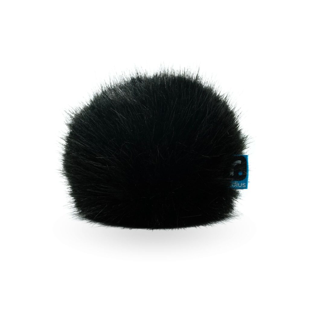 Foam windscreen and fur cover components separated showing dual protection system