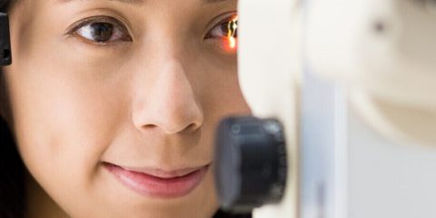 Woman checking vision with equipment Woman checking vision with equipment