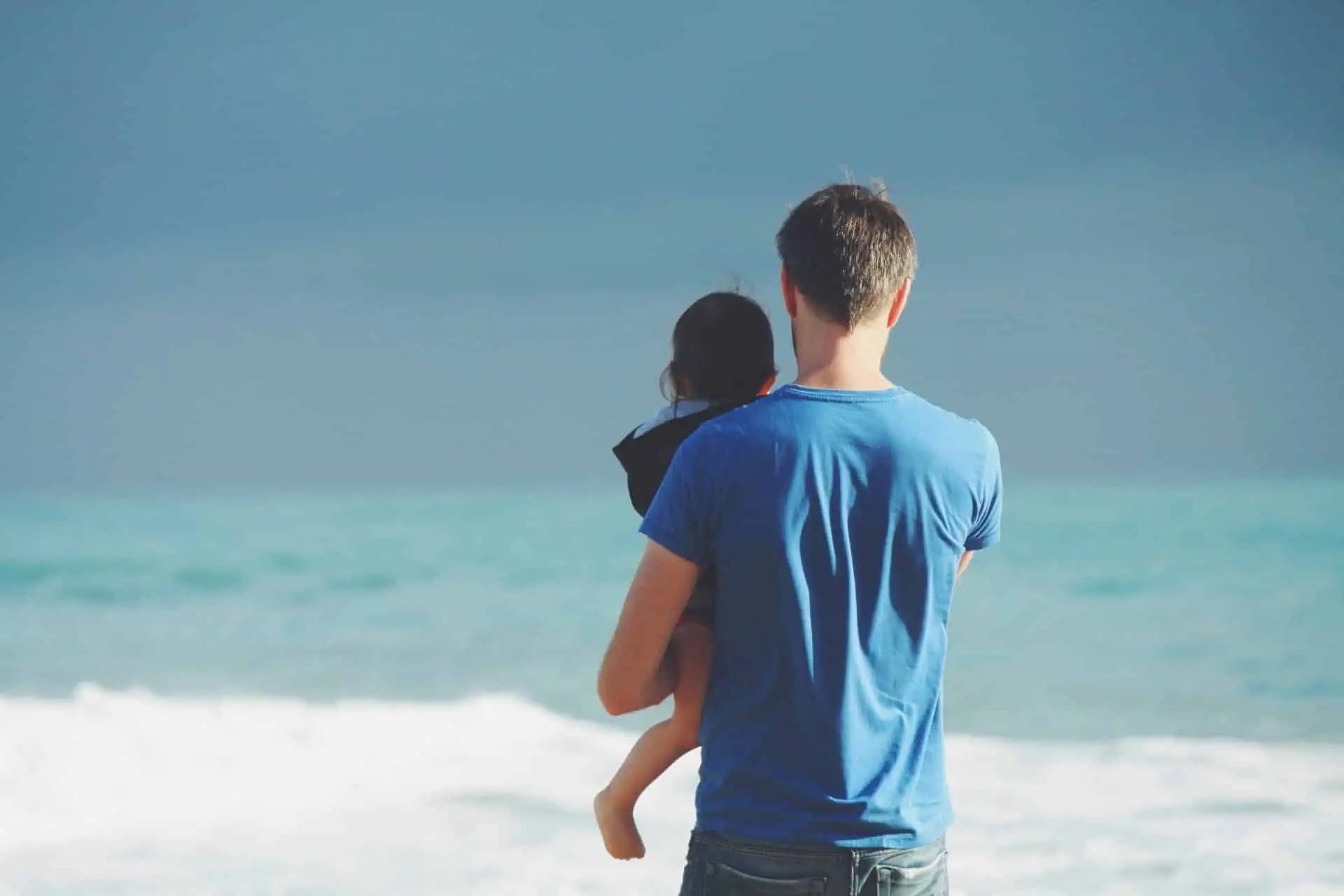 Father and child at the beach