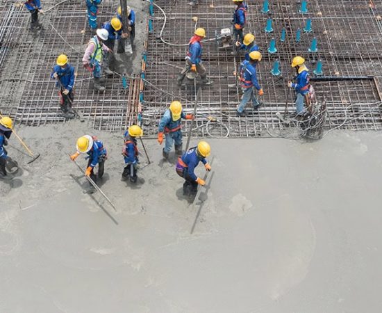 Concrete floor slab placement and finishing