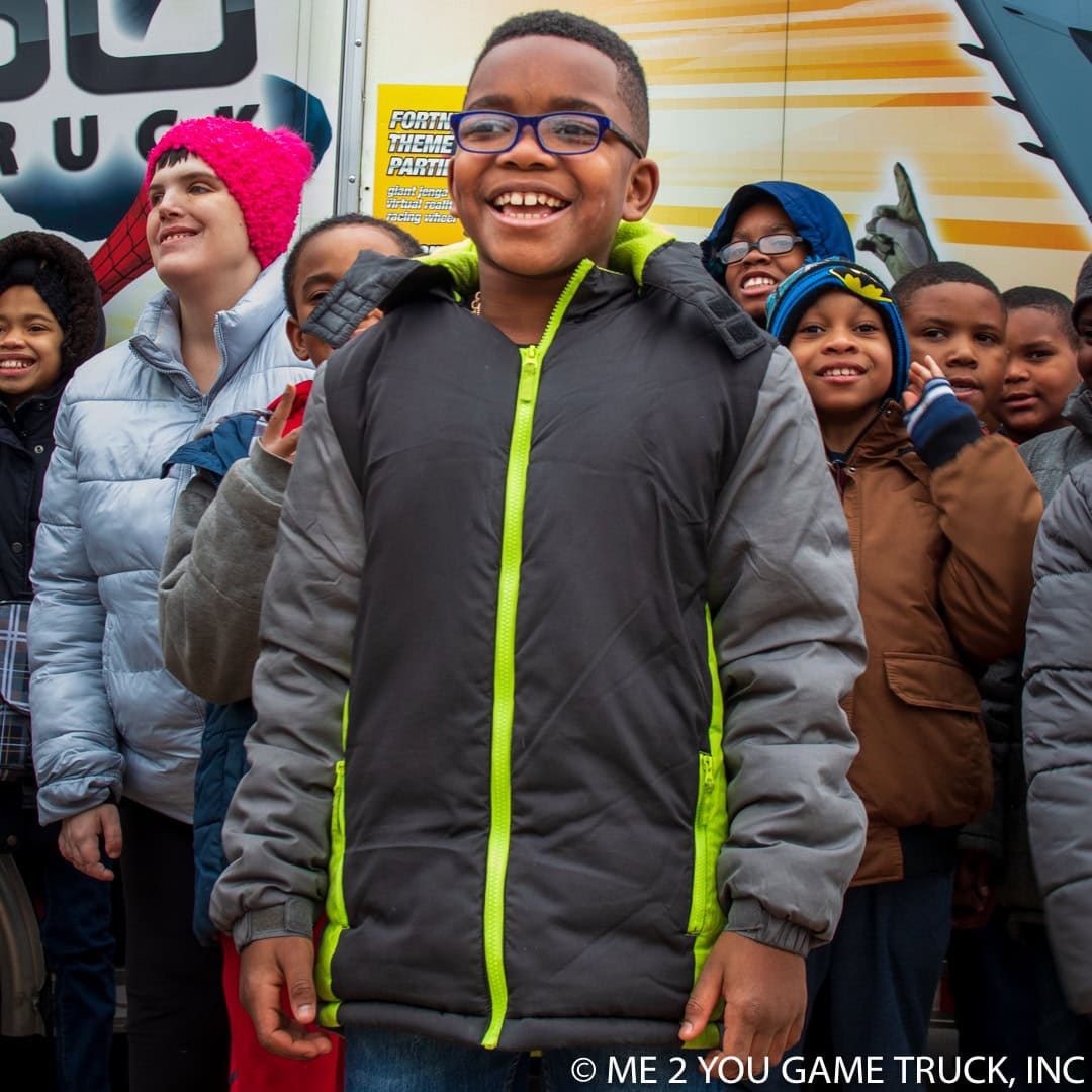 Kids cheering at a Me 2 You Game Truck birthday party in St. Louis