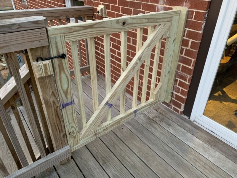Dog gate for a deck myfixituplife How to build a DIY dog gate on a deck MyFixitUpLife MyFixitUpLife DIY dog gate deck gate for dogs deck gate ideas myfixituplife