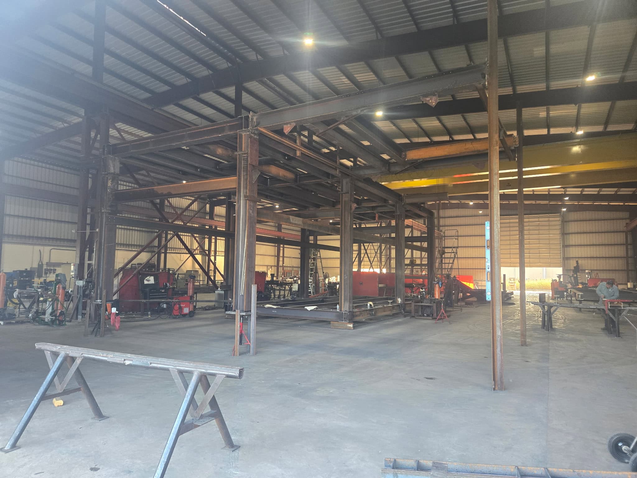 Structural steel skid structure with vertical columns and horizontal beams during fit-up and welding at the WeldIT shop