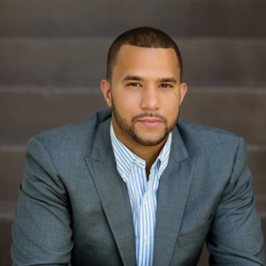 Professional businessman in a suit indicating Office Evolution franchising opportunities in a corporate setting.