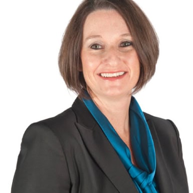 Modern professional woman smiling, representing Office Evolution franchising opportunities and business growth.
