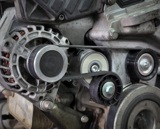 Pk belt, pulleys and alternator at modern car engine after servicing