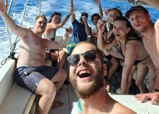 People enjoying a private motor boat tour from Opatija, discovering secluded island beaches – ideal island escape for up to 15 people.