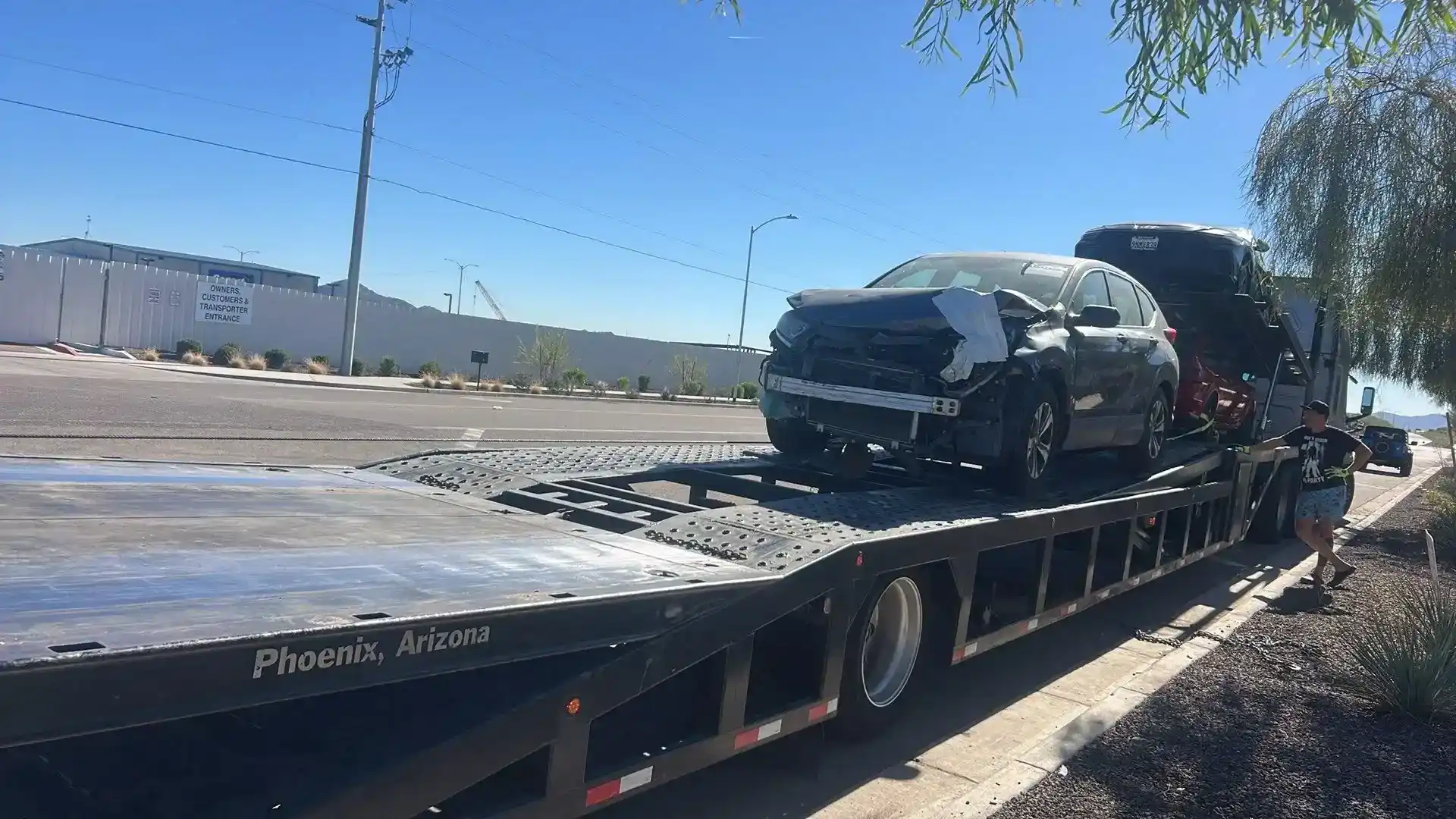 Freeway Towing & Storage winching an inoperable, non-running vehicle onto a transport trailer in Phoenix, AZ