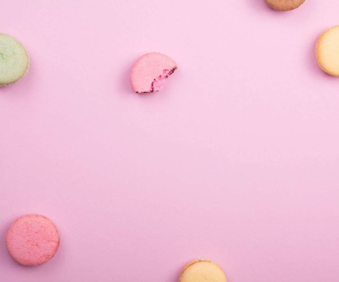 colorful macarons on a pink background colorful macarons on a pink background