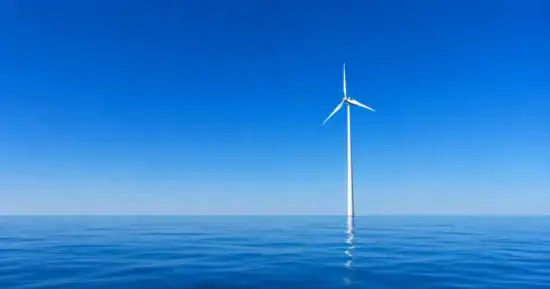 single wind turbine on a calm sea