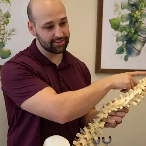 Dr. Matt explains spinal health to a patient in palm desert, CA.
