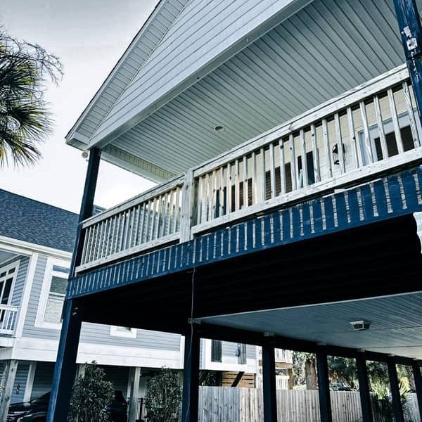New deck handrails installed in Oak Island NC by RGR Construction & Roofing, improving safety and code compliance for a coastal home.
