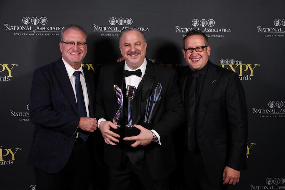 Best Selling Author - Award Winning Filmmaker and Top Sales Expert Richard Tyler Holding His Three EXPY® Awards
