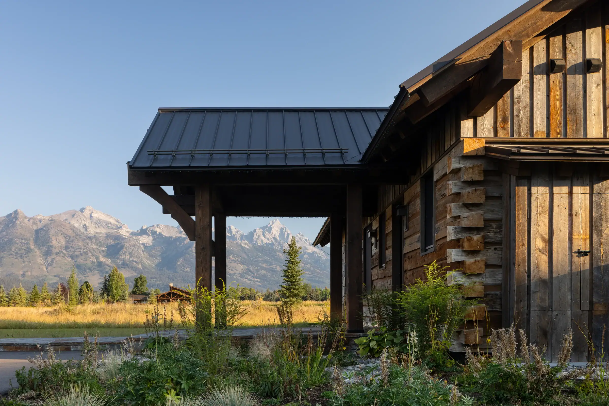Exterior detail showing the faux-log dovetail corners