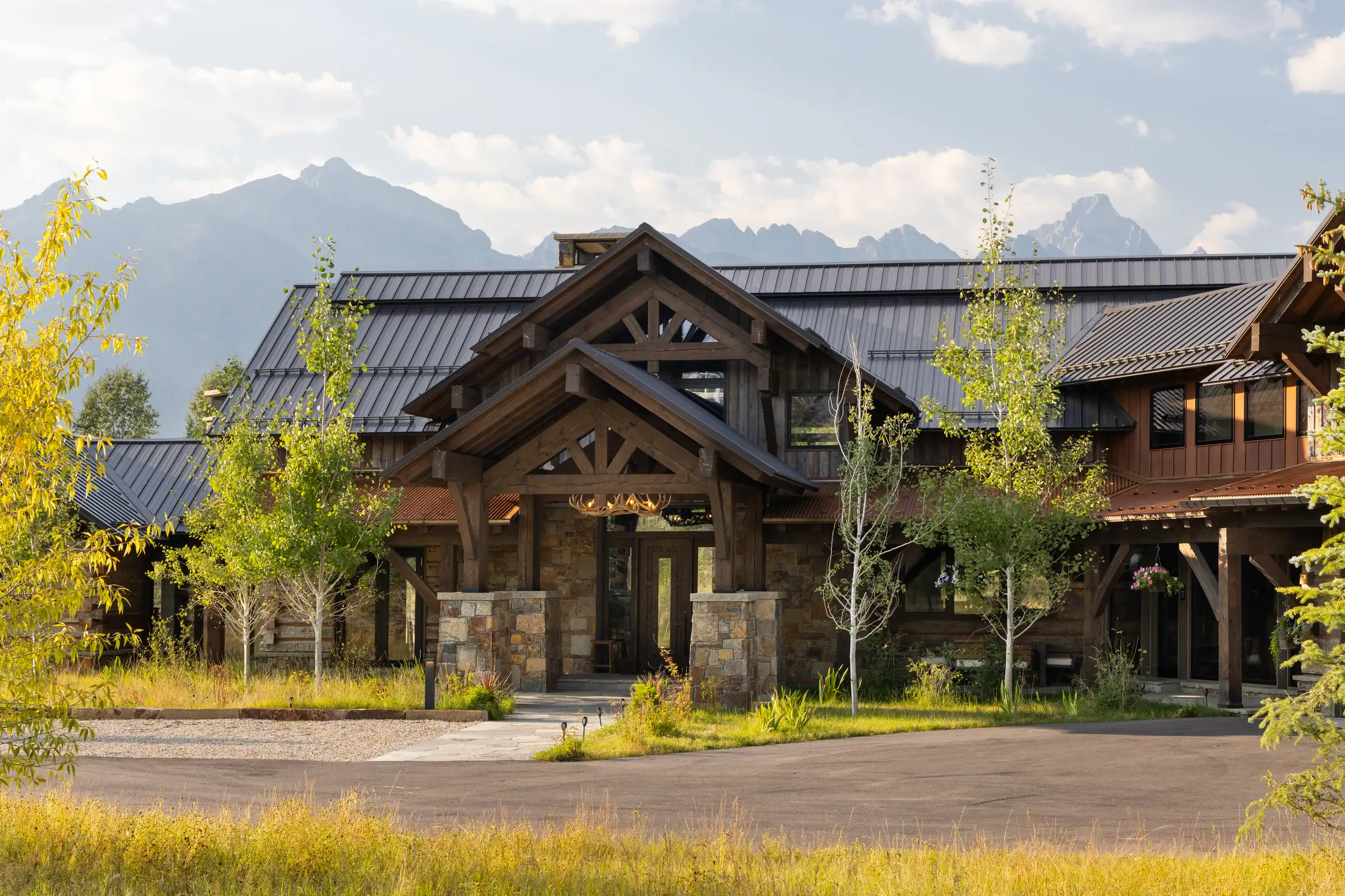 Timber-framed front entry with the Tetons beyond