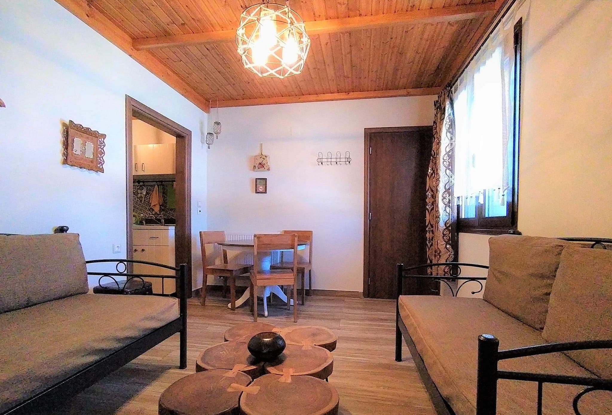 Living room and dining area in Two Room Apartment Chryssa at Rustic House Embonas Rhodes