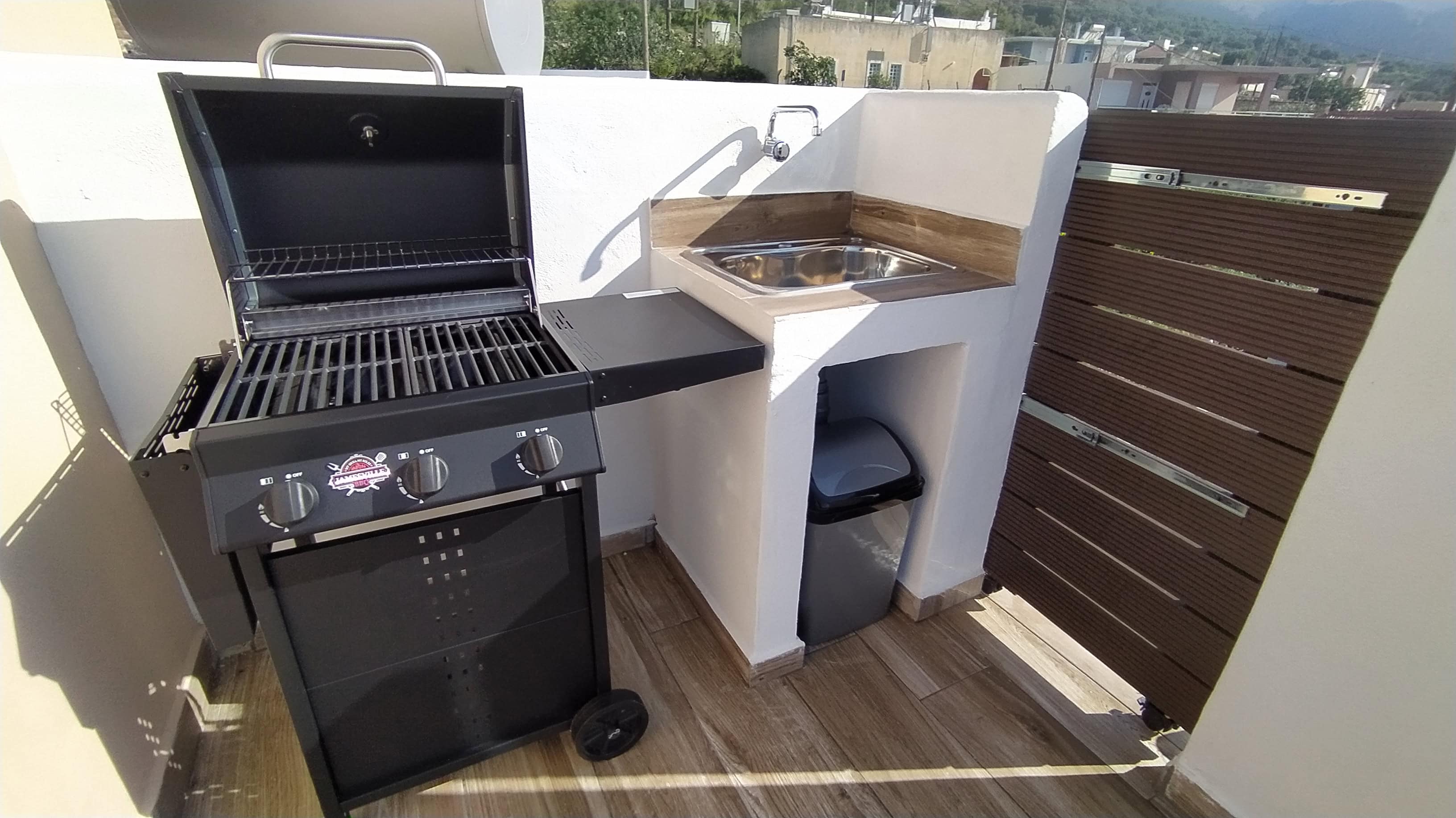 Private barbecue and outdoor sink area at Apartment Smaro Rustic House Embonas Rhodes
